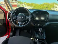 2024 Kia Soul dashboard from the driver's seat, with center touchscreen, climate controls and automatic gear selector